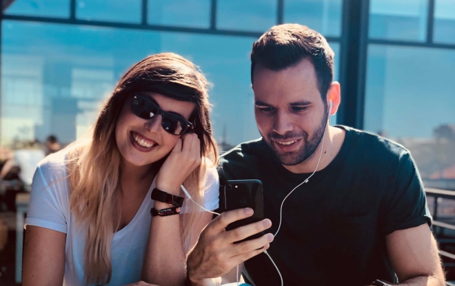 Man and Woman Listening to Headphones