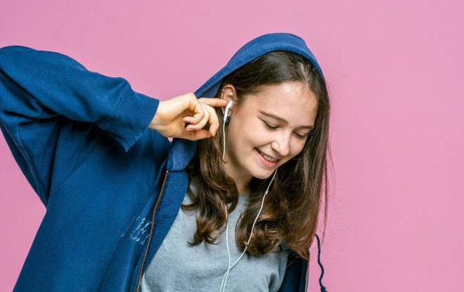 Teenage girl listening to headphones